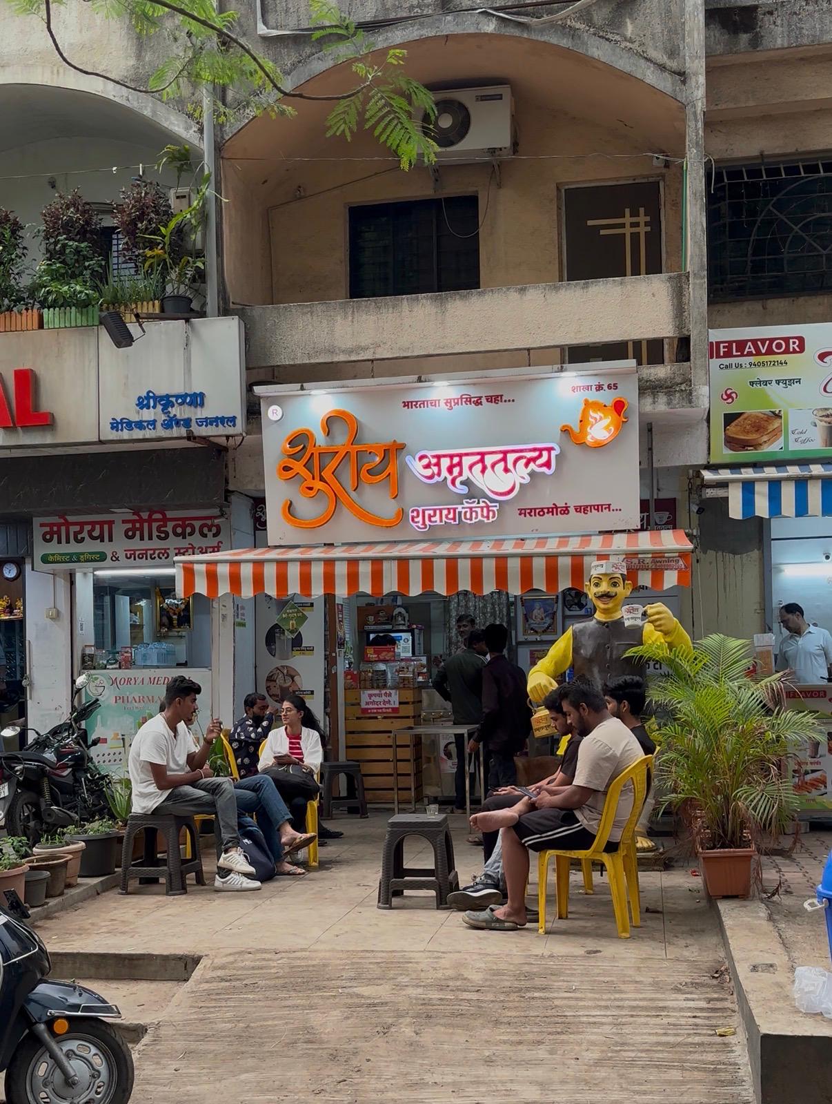 Shuray Amruttulya cafe branch no. 65 with customers seated outside the shop