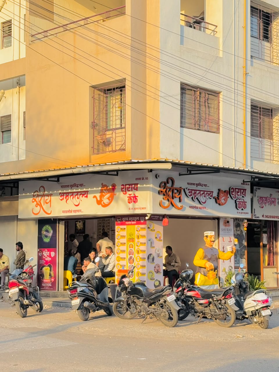 Corner Shuray Amruttulya cafe outlet, branch no. 93, with customers seated inside