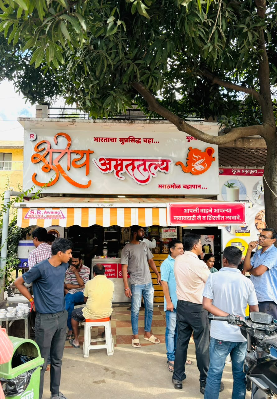 Customers queuing at a busy Shuray Amruttulya tea outlet during the day
